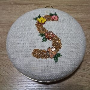 Embellished Round Clutch with Floral 'S' Sequin Design